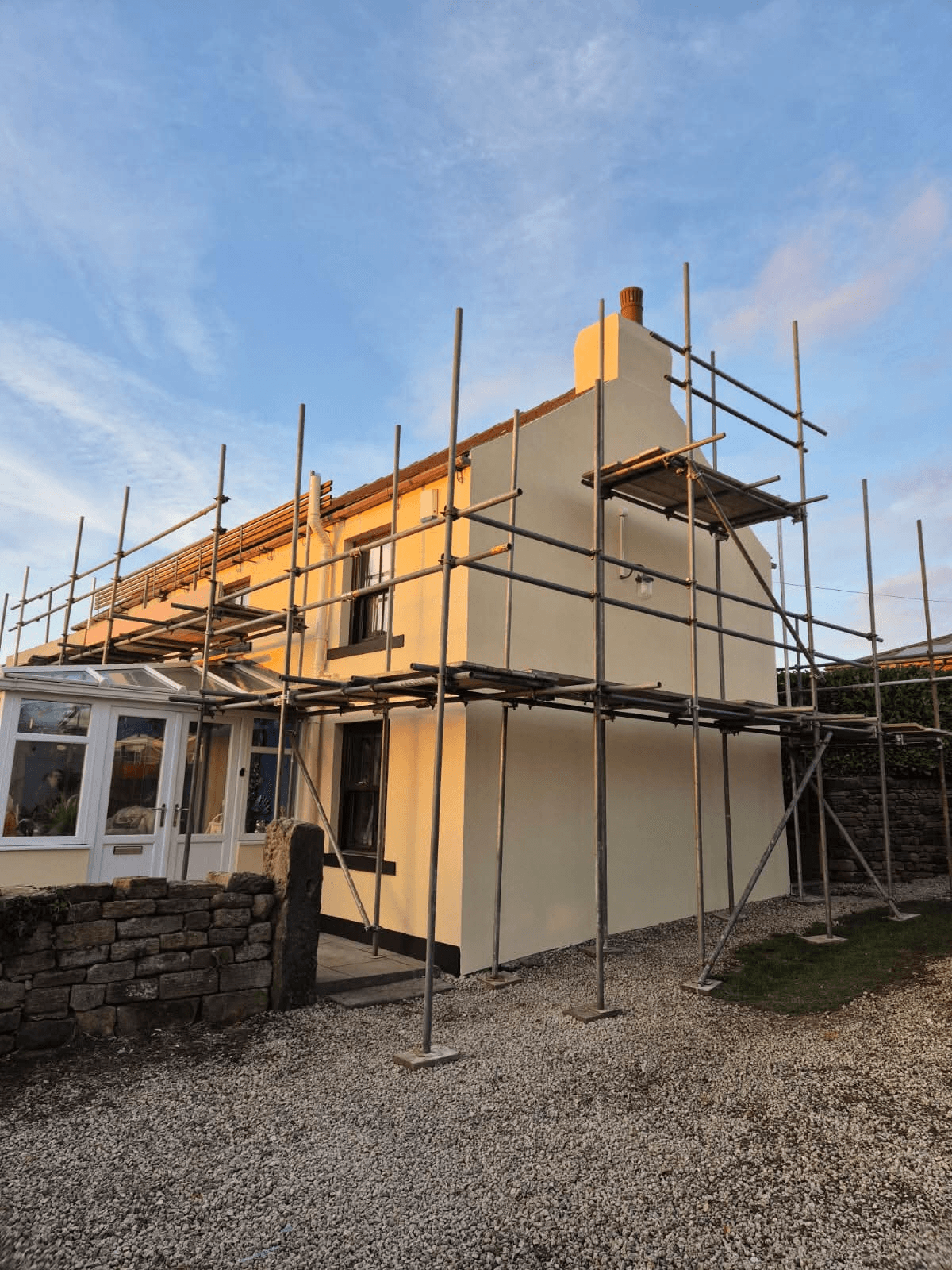 Cottage render in progress with scaffolding
