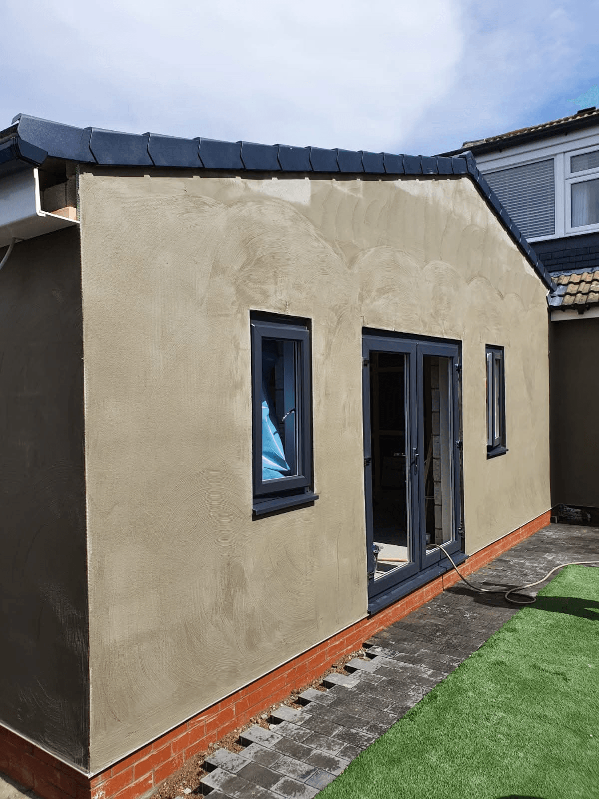 Extension with sand coloured render